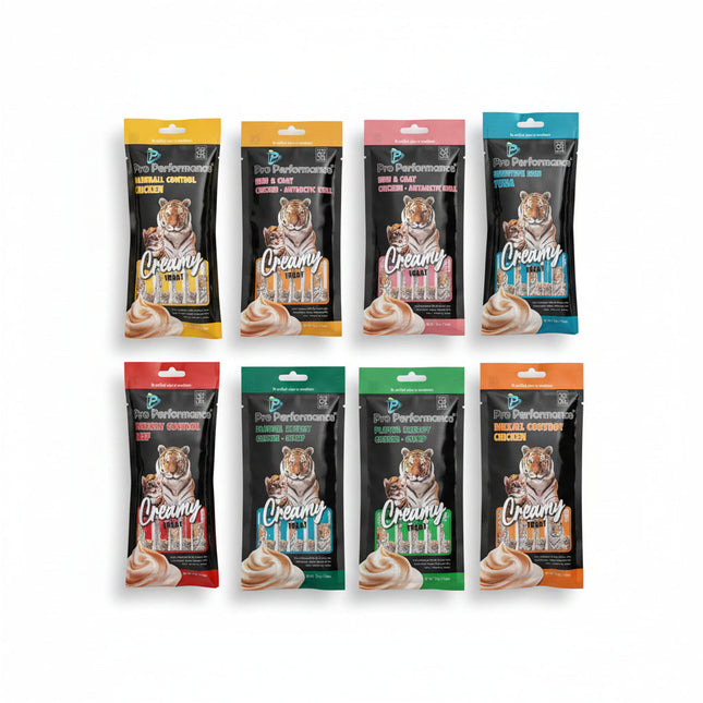 Six packages of Pro Performance cat treats with tiger branding on a textured surface.