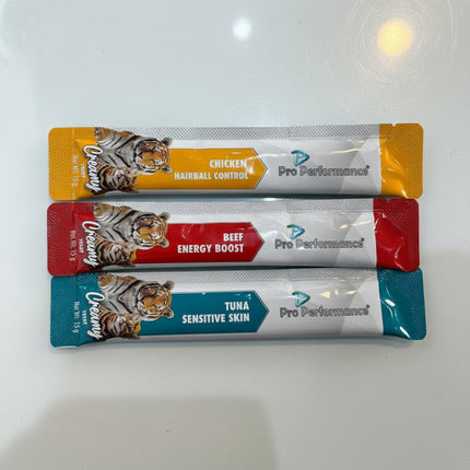 Three Pro Performance pet food packets with different flavors on a white background