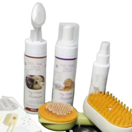 Set of pet grooming products including bottles, a brush, and a comb on a white background.