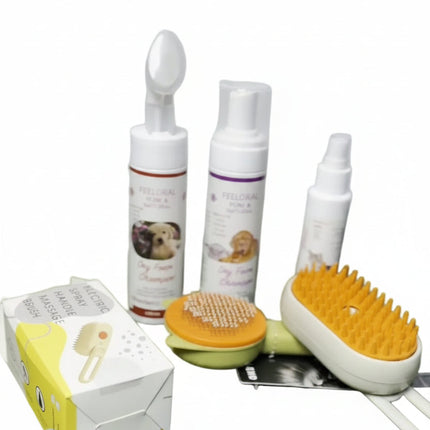 Set of pet grooming products including bottles, a brush, and a box on a white background